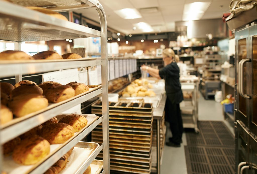 Bread on a shelf in a kitchen.