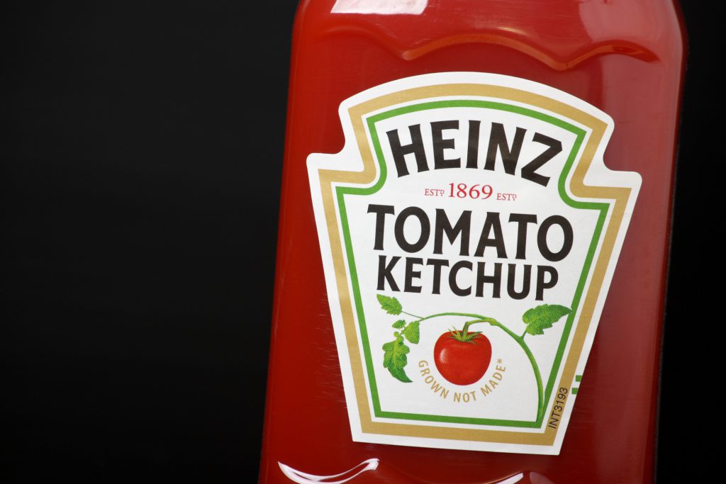 A bottle of red Heinz Tomato Ketchup.