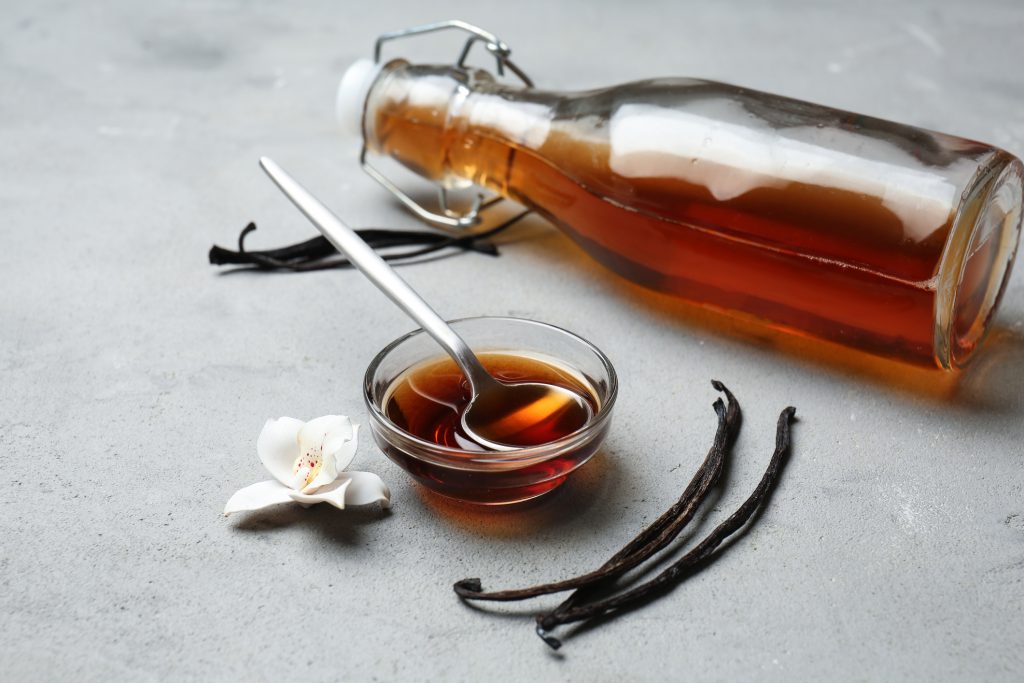 Vanilla beans and extract on a table