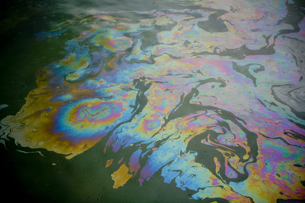 Water with an oily rainbow-colored sheen on top.