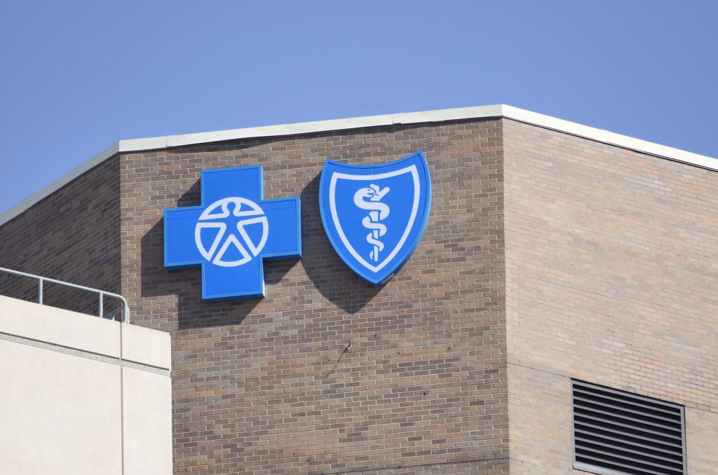Blue Cross Blue Shield's logo on a building.