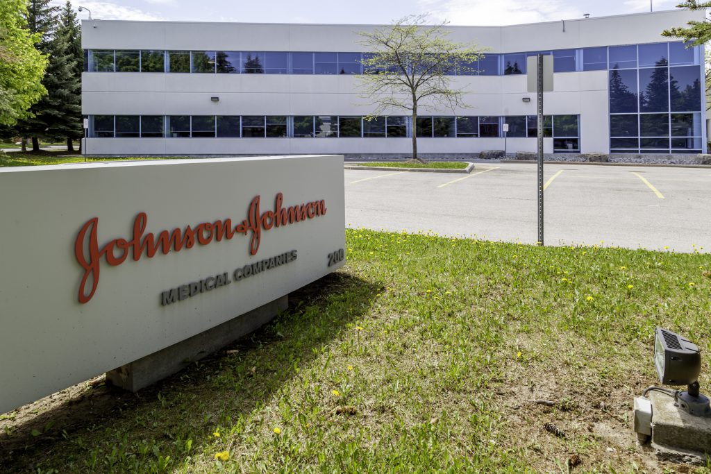 Johnson & Johnson's logo on a sign outside an office building.