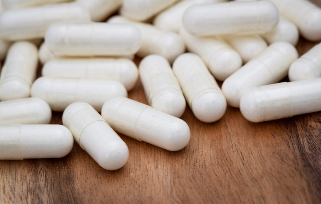 A pile of white capsules.